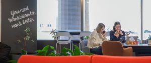 Two people working in a coworking space